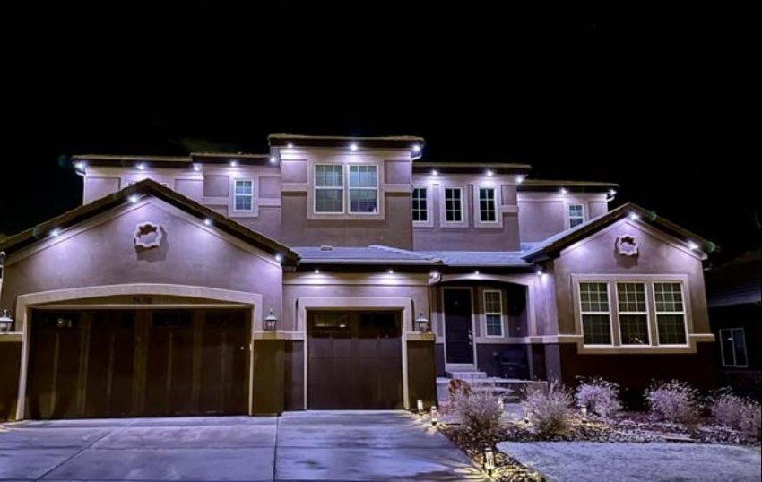 Two-story home with Brighter Nights by TrueSpec soffit lighting in white